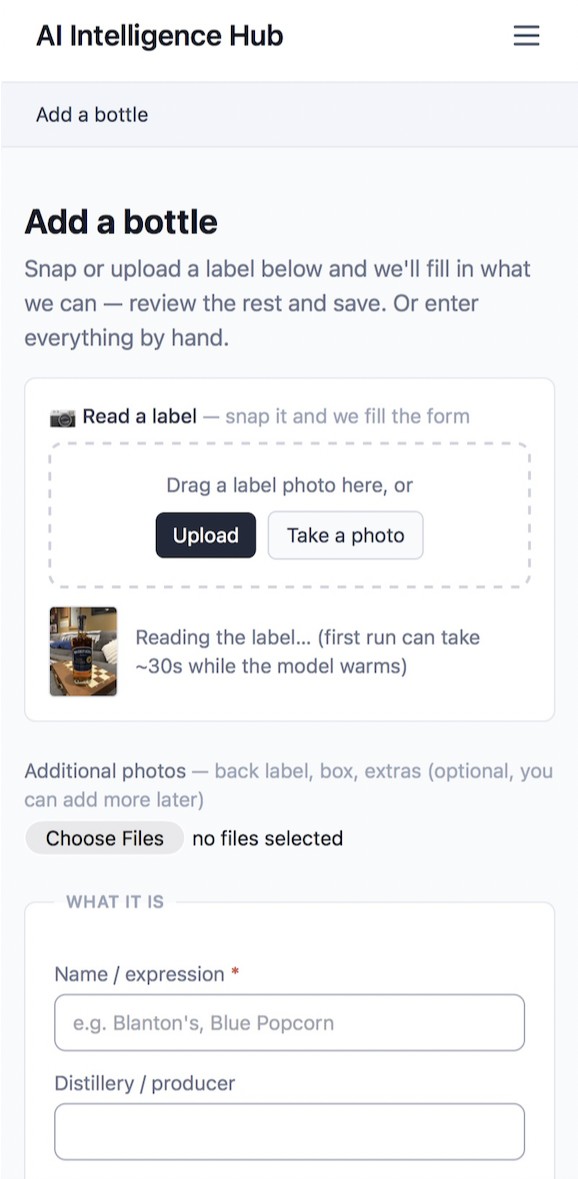 Spirit Spy's Add a bottle screen: snap or upload a label and the model fills in the form
